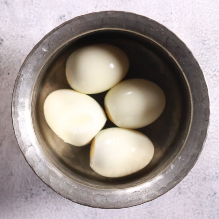 Peeled scored boiled eggs