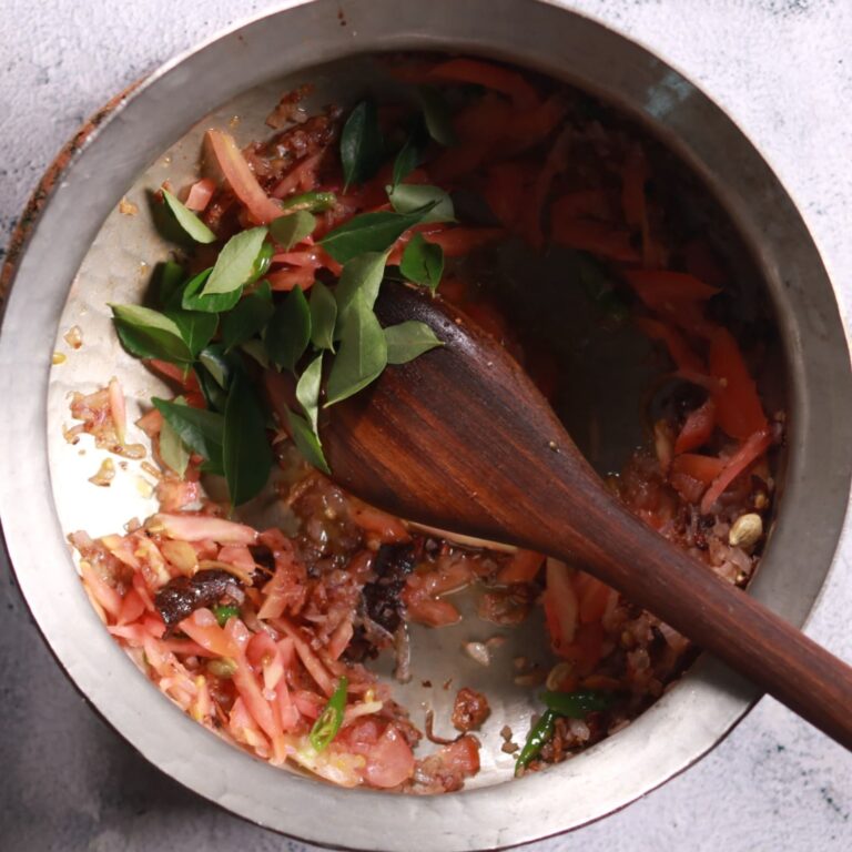 Sautéing curry leaves in pan
