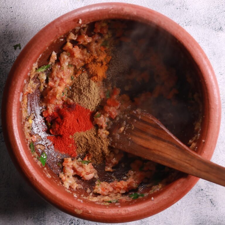 Adding spices to pan