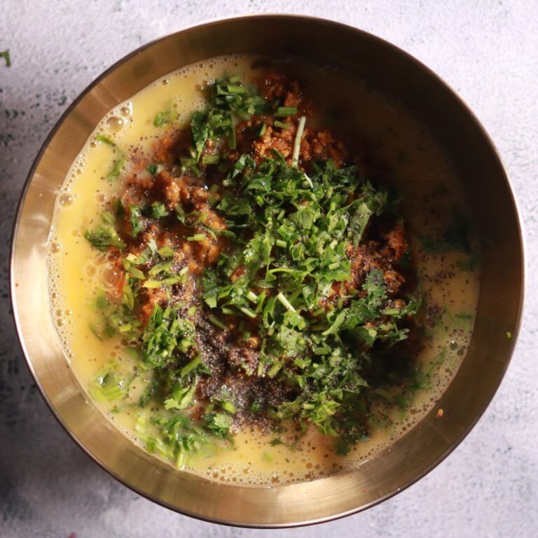 Mixing eggs and herbs