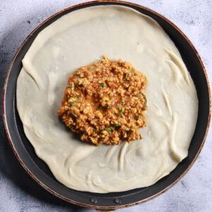 Placing dough with filling