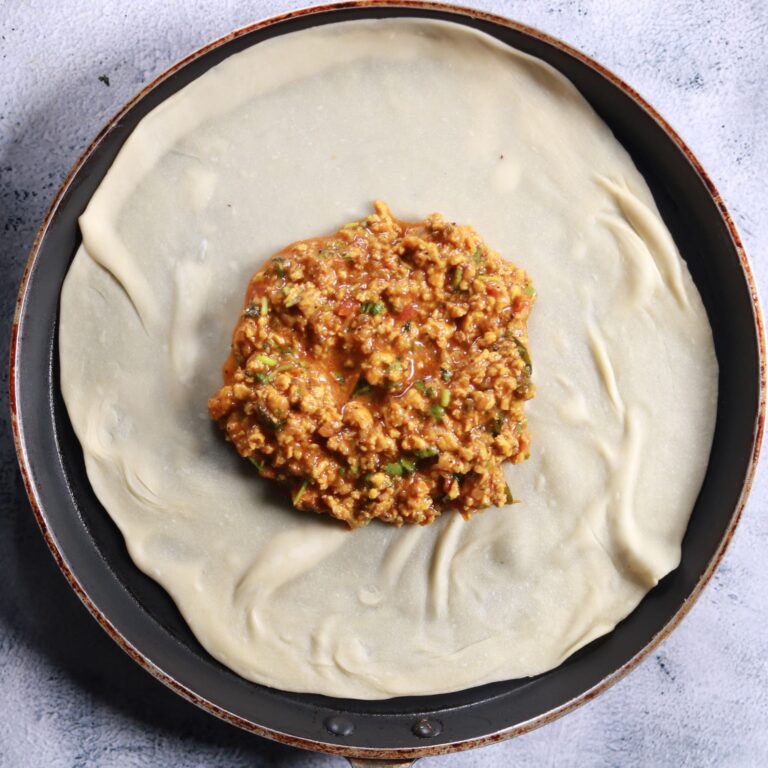 Placing dough with filling