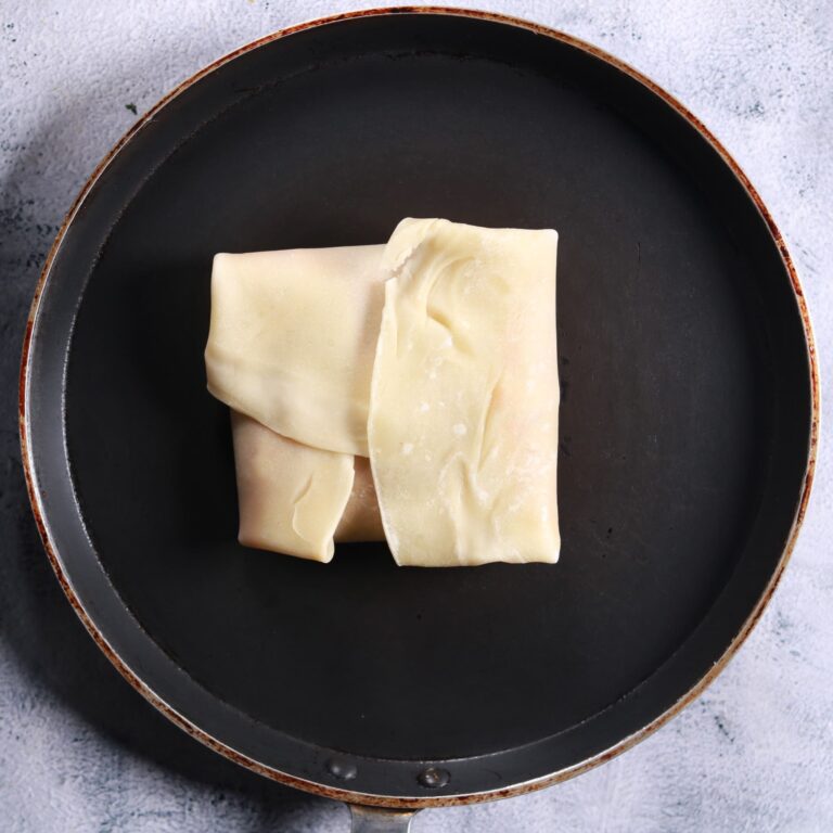 Folding dough over filling