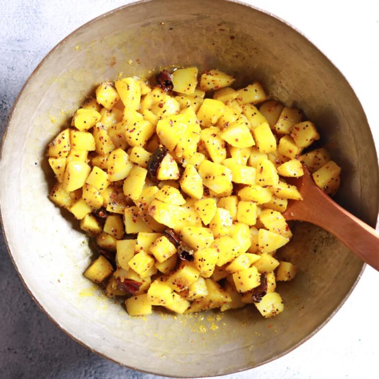 tossing potato cubes
