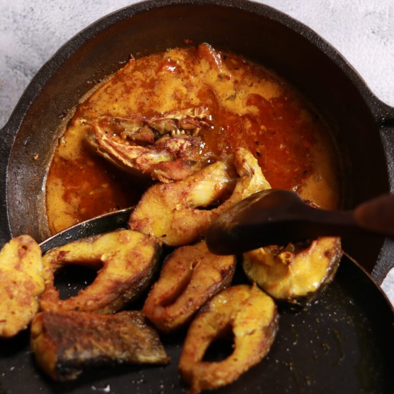 Gently placing fried fish