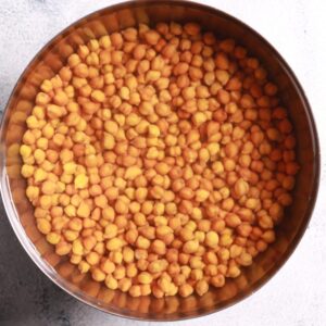 Washing soaked black chana thoroughly