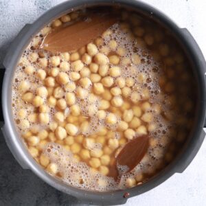 Pressure cooker whistling on stove