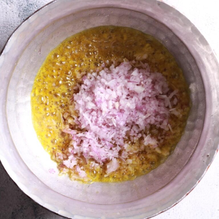 Chopped onions frying until golden