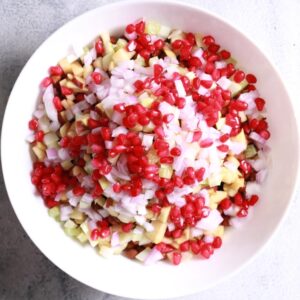 Mixing chana with fresh ingredients