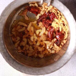 Garlic slices frying golden
