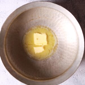 Heat butter in pan over medium-high heat.